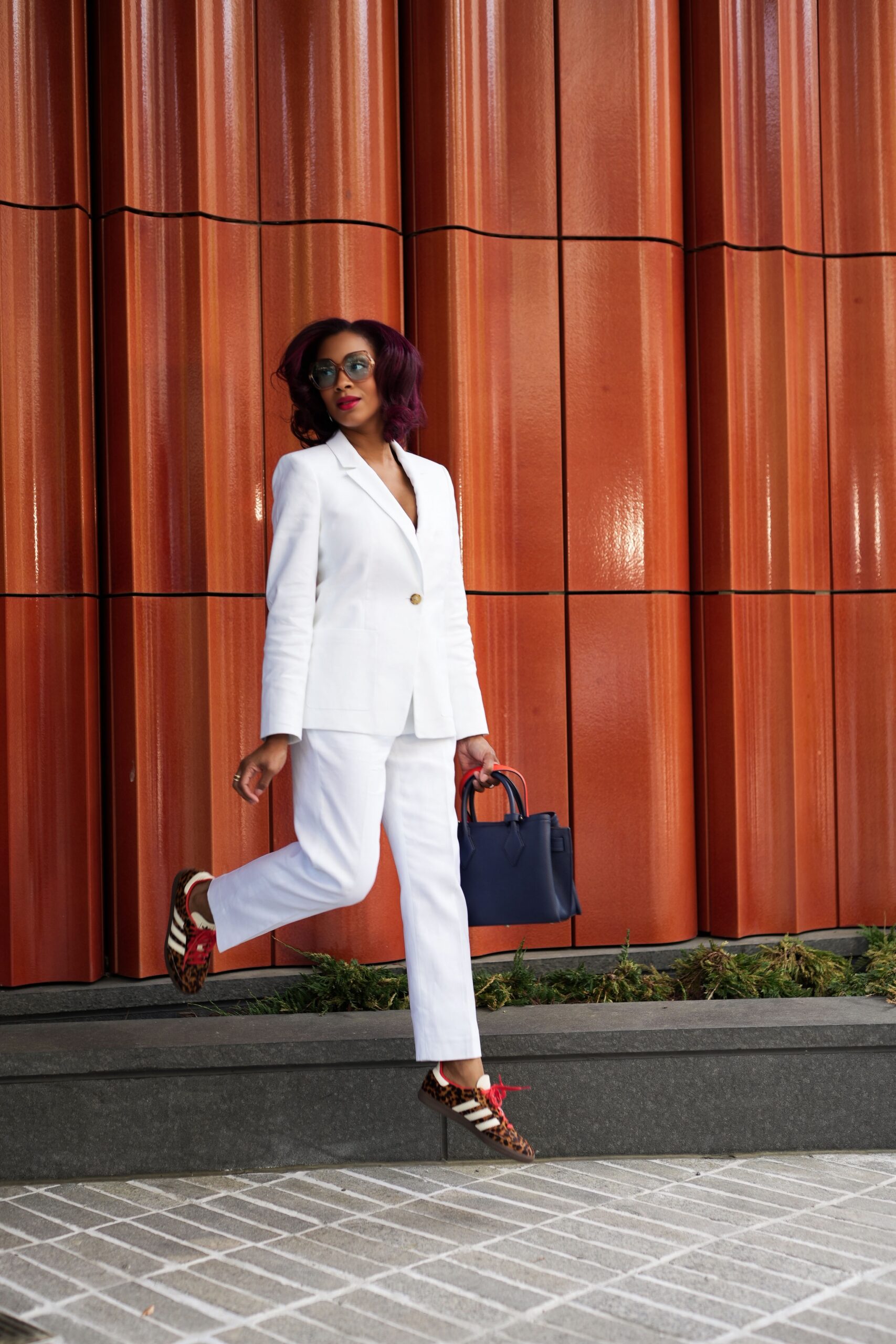 Yana B. in a styled white suit
